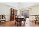 Traditional dining room with wood floors, chandelier, and glass sliding door at 502 Cosmic Star Pl, Henderson, NV 89052