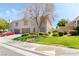 Charming two-story home with well-manicured lawn, tree, and mature landscaping at 502 Cosmic Star Pl, Henderson, NV 89052