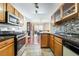 Kitchen area with tiled floors and stainless steel appliances at 502 Cosmic Star Pl, Henderson, NV 89052