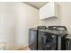 Laundry room equipped with modern Samsung washer and dryer and overhead storage at 502 Cosmic Star Pl, Henderson, NV 89052