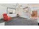 Living room featuring staircase, and dining room with wood table and chairs at 502 Cosmic Star Pl, Henderson, NV 89052