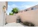 View of the outdoor patio area with plants and an air conditioning unit at 502 Cosmic Star Pl, Henderson, NV 89052