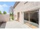 Exterior patio with light colored walls, gated entrance, and sliding glass door at 502 Cosmic Star Pl, Henderson, NV 89052