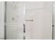 Tiled shower with a glass sliding door and a built in caddy at 502 Cosmic Star Pl, Henderson, NV 89052