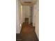 Hallway featuring neutral walls and flooring, with multiple doorways at 5220 Indian River Dr # 277, Las Vegas, NV 89103