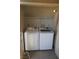 Enclosed laundry area featuring modern white washer and dryer appliances at 5220 Indian River Dr # 277, Las Vegas, NV 89103