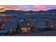 Stunning aerial view of the neighborhood with mountain views at sunset at 5252 Sunstone Mesa Dr, Las Vegas, NV 89166