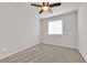 Bedroom with neutral walls, plush carpet and a ceiling fan at 5252 Sunstone Mesa Dr, Las Vegas, NV 89166