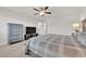 Well-lit bedroom features a ceiling fan and neutral decor creating a peaceful space at 5252 Sunstone Mesa Dr, Las Vegas, NV 89166