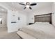 Bedroom featuring a white bed bench, carpet and a ceiling fan at 5252 Sunstone Mesa Dr, Las Vegas, NV 89166