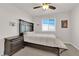 Bedroom with a dark wood bed, comfortable bedding, and a side table at 5252 Sunstone Mesa Dr, Las Vegas, NV 89166