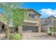 Charming two-story home with a two-car garage and a well-maintained paver driveway at 5252 Sunstone Mesa Dr, Las Vegas, NV 89166