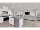 Spacious kitchen with stainless steel appliances, granite countertops, and a breakfast bar with seating at 5252 Sunstone Mesa Dr, Las Vegas, NV 89166