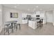 Bright kitchen features white cabinets, granite countertops, and stainless steel appliances at 5252 Sunstone Mesa Dr, Las Vegas, NV 89166