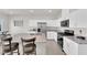 Bright kitchen features white cabinets, granite countertops, and stainless steel appliances at 5252 Sunstone Mesa Dr, Las Vegas, NV 89166