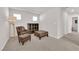 Cozy sitting area with an accent chair and ottoman at 5252 Sunstone Mesa Dr, Las Vegas, NV 89166