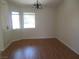 Spacious dining room with wood flooring, neutral walls and natural light at 5488 Apron Ct, Las Vegas, NV 89122