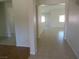 Bright hallway with neutral tile flooring and white walls at 5488 Apron Ct, Las Vegas, NV 89122
