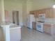 Bright kitchen with white appliances and countertops at 5488 Apron Ct, Las Vegas, NV 89122