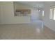 Open-concept living room with tile flooring and view into the kitchen at 5488 Apron Ct, Las Vegas, NV 89122