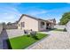 Backyard with artificial turf, gravel, and patio space, perfect for outdoor living at 5600 Blue Peak Ave, Las Vegas, NV 89131