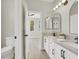 Bathroom with dual vanity, modern fixtures, and bright lighting at 5600 Blue Peak Ave, Las Vegas, NV 89131