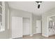 The bedroom has closet and bathroom access in neutral gray tones at 5600 Blue Peak Ave, Las Vegas, NV 89131
