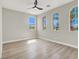 The bedroom has arched windows that allow in a lot of natural light at 5600 Blue Peak Ave, Las Vegas, NV 89131
