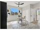 The bedroom has ample natural light, a modern ceiling fan, and a large window at 5600 Blue Peak Ave, Las Vegas, NV 89131