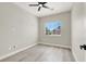 A spacious bedroom with a ceiling fan, light wood floors, and lots of natural light at 5600 Blue Peak Ave, Las Vegas, NV 89131