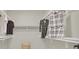 A walk-in closet with custom shelving and hanging rods for organized clothing storage at 5600 Blue Peak Ave, Las Vegas, NV 89131