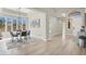 Elegant dining room with modern chandelier, large windows, and stylish decor at 5600 Blue Peak Ave, Las Vegas, NV 89131