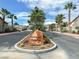 Community entrance to Heritage Estates with beautiful palm trees and desert landscaping at 5600 Blue Peak Ave, Las Vegas, NV 89131