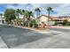 Gated entrance to Heritage Estates with lush landscaping and palm trees at 5600 Blue Peak Ave, Las Vegas, NV 89131