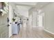 Bright entryway with light wood floors, open floorplan, and contemporary decor at 5600 Blue Peak Ave, Las Vegas, NV 89131