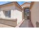 Inviting front entrance featuring a decorative wreath on the front door, framed by sidelights at 5600 Blue Peak Ave, Las Vegas, NV 89131