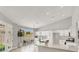 Modern kitchen featuring quartz countertops, white cabinetry, and stainless steel appliances at 5600 Blue Peak Ave, Las Vegas, NV 89131