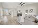Open-concept living room with fireplace and contemporary furnishings at 5600 Blue Peak Ave, Las Vegas, NV 89131