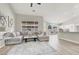 Spacious open-concept living room seamlessly connects to the modern kitchen and dining area at 5600 Blue Peak Ave, Las Vegas, NV 89131
