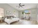 Spacious main bedroom with neutral tones, natural light, modern decor, and light wood flooring at 5600 Blue Peak Ave, Las Vegas, NV 89131