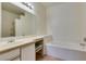 Bright bathroom with tub and vanity, features natural light and is ready for personalization at 5751 E Hacienda Ave # 105, Las Vegas, NV 89122