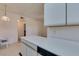 The kitchen features a breakfast bar and a dishwasher with the living area visible beyond at 5751 E Hacienda Ave # 105, Las Vegas, NV 89122