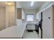 Bright kitchen features ample counter space, white appliances, and a window with natural light at 5751 E Hacienda Ave # 105, Las Vegas, NV 89122