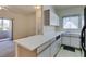 Efficient kitchen featuring white cabinets, laminate countertops, and modern appliances perfect for everyday meal prep at 5751 E Hacienda Ave # 105, Las Vegas, NV 89122