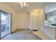 Living room with sliding glass doors open to the outdoors, flowing into the kitchen and entry areas at 5751 E Hacienda Ave # 105, Las Vegas, NV 89122