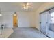 Spacious living room featuring sliding glass doors to a balcony, plus easy access to the bathroom at 5751 E Hacienda Ave # 105, Las Vegas, NV 89122