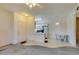 Bright living room leading to kitchen and dining area, complemented by a decorative ceiling fan at 5751 E Hacienda Ave # 105, Las Vegas, NV 89122