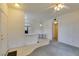 Living space boasting a breakfast bar, ceiling fan, and door at 5751 E Hacienda Ave # 105, Las Vegas, NV 89122