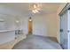 Welcoming living space with breakfast bar, ceiling fan, and carpet at 5751 E Hacienda Ave # 105, Las Vegas, NV 89122