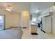 Open-concept living area with a view of the kitchen and access to the outside at 5751 E Hacienda Ave # 105, Las Vegas, NV 89122
